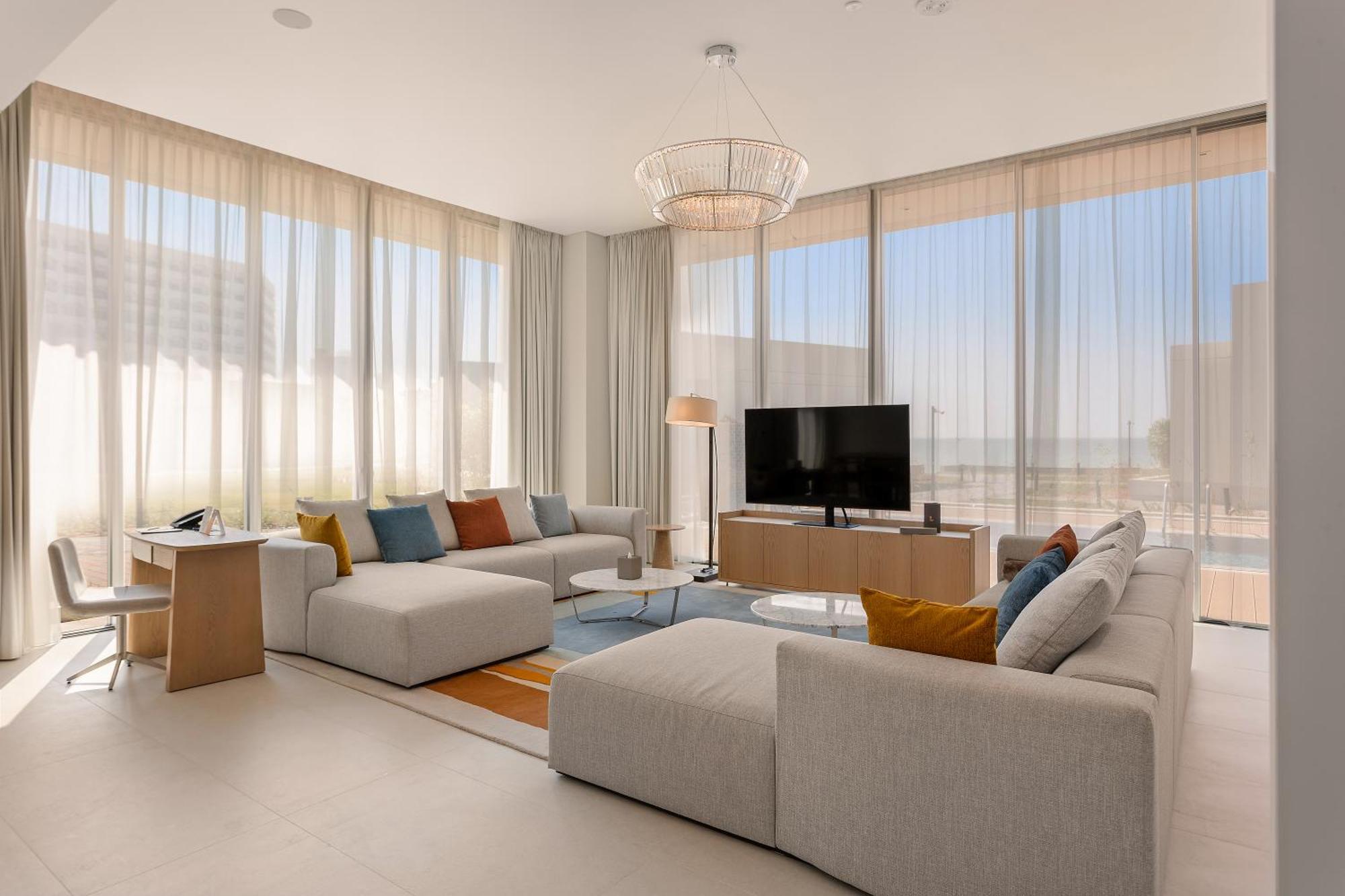 Ajman Hotel & Villas By Blazon Hotels Εξωτερικό φωτογραφία The living room of a three-bedroom villa at The Edition